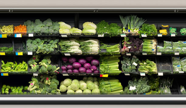 istock Vegetables in long open fridge at supermarket 1805522298