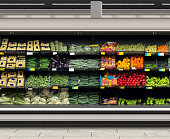 Vegetables in long open refrigerator at supermarket