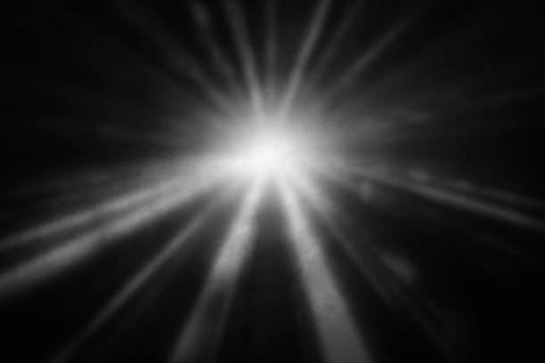 istock White and gray smoke against black background with light beams 1805536054