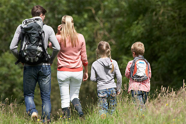 istock Family Hiking In Countryside 180554020