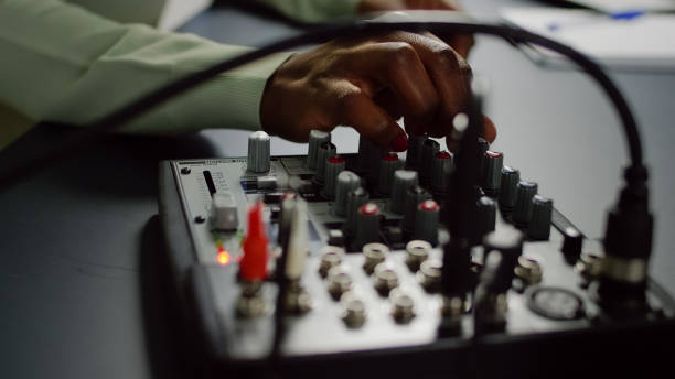 istock Close up of afro vlogger making sound adjustments 1805545326