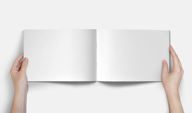 istock Hand Holding Horizontal A4 Brochure Mockup on a White Background 1805554534