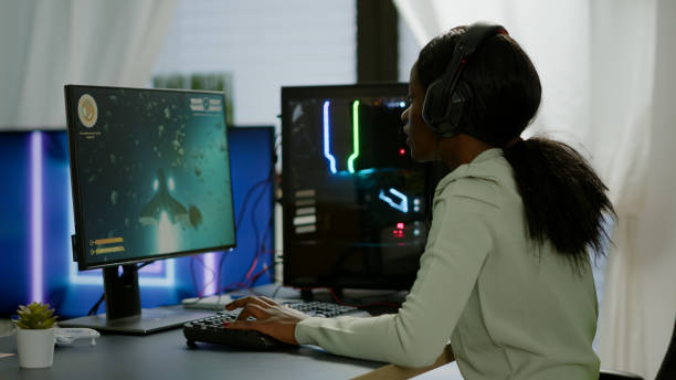 istock African happy gamer winning space shooter game 1805557264