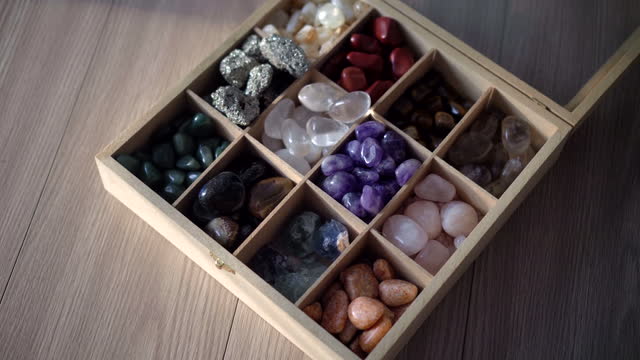 Quartz Crystals stones in Collection of various stones and minerals in a wooden box