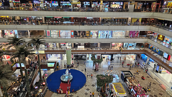 Noida, India - July 8 2023: View of beautiful Gaur City Shopping mall at Greater Noida west. People shopping in the mall.