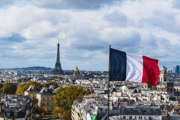 istock Paris skyline panorama with the Eiffel Tower and French flag 1805572650