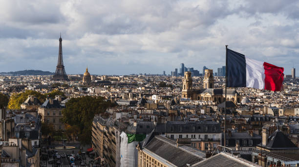 istock Paris skyline panorama with the Eiffel Tower and French flag 1805574812