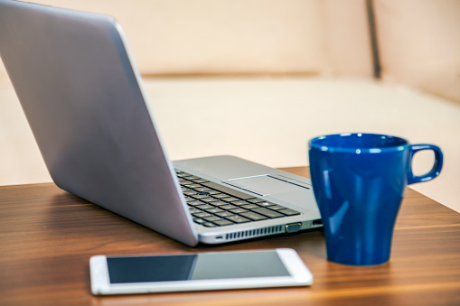 laptop and telephone on the desk