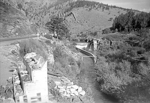 Handy Dam on the Big Thompson River at entrance to Big Thompson Canyon, Colorado. Water being diverted to the power plant is in the canal at the left of the river. Photo take 1949 September 2, years before the devastating flood in 1976. After the flood the dam was rebuilt and renamed Dille Diversion Dam. The dam has also been known as the Big Thompson Dam. Highway 34 is on the left.