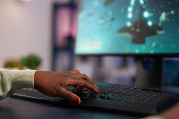 istock Close up of successful pro gamer pressing computer keyboard 1805597258