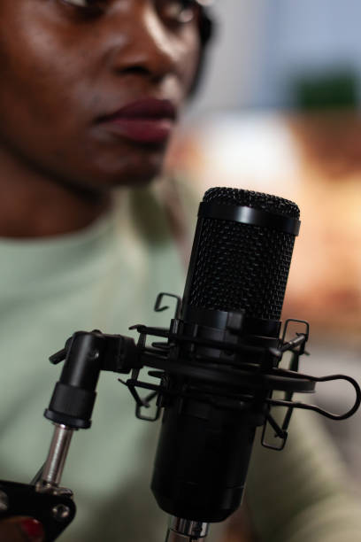 istock Closeup of social media content creator talking into vlogging microphone 1805607213
