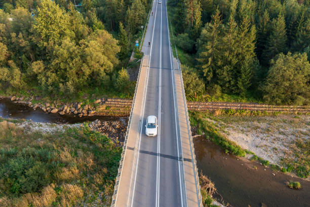istock Car on a bridge, aerial view 1805608861