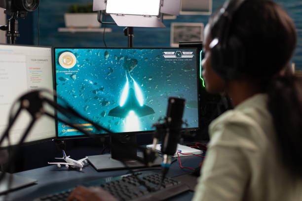 istock African american pro gamer wearing headset talking with remote player 1805615286