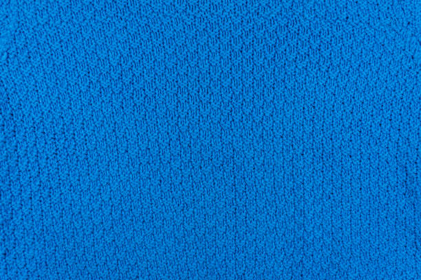 istock Texture and pattern of a knitted blue wool sweater. Background of warm handmade wool fabric. 1805617445