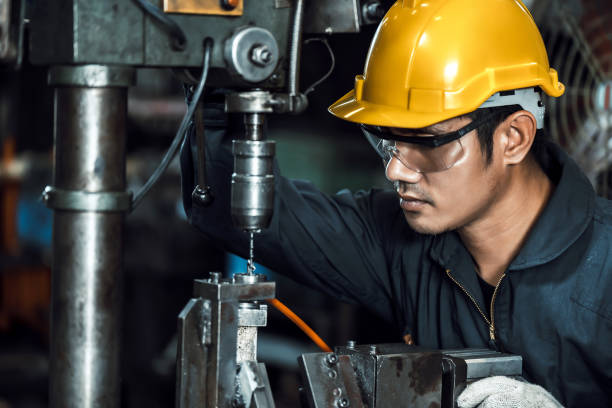 istock engineer mechanic man working metal machine at factory 1805619590