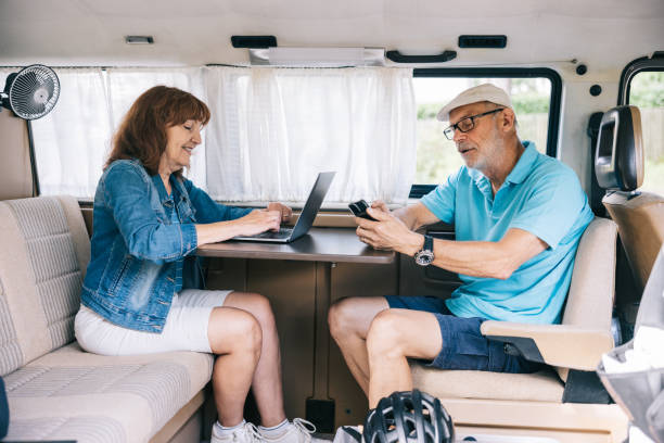 istock Senior couple working from their campervan 1805620161