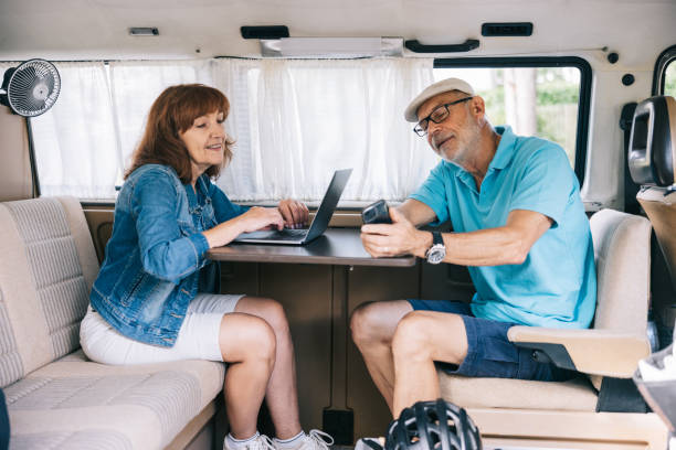 istock Senior couple working from their campervan 1805620176