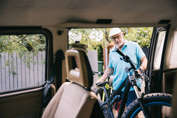 istock Senior couple loading their bikes into their campervan. 1805620196