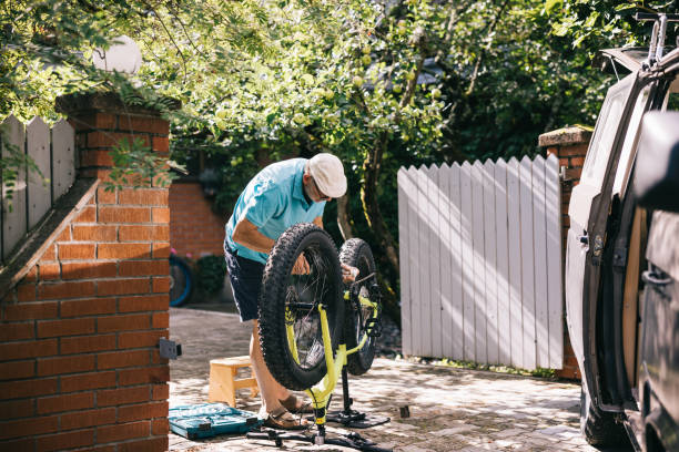 istock Senior man doing maintenance on his fatbike 1805620221