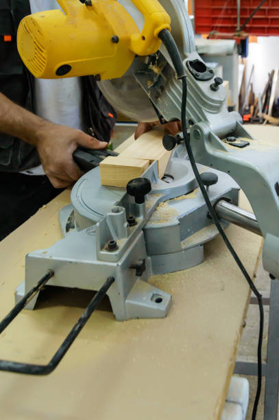 istock A Professional Carpentry Worker is Shaping a Wooden Plank Using a Circular Saw. 1805624514