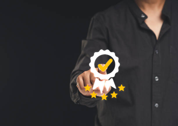 istock The best quality symbol assurance for a product, service, and ISO certification on a hand businessman 1805634564