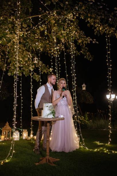 istock newlyweds happily cut and taste the wedding cake 1805644740