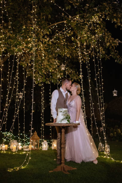 istock newlyweds happily cut and taste the wedding cake 1805648156