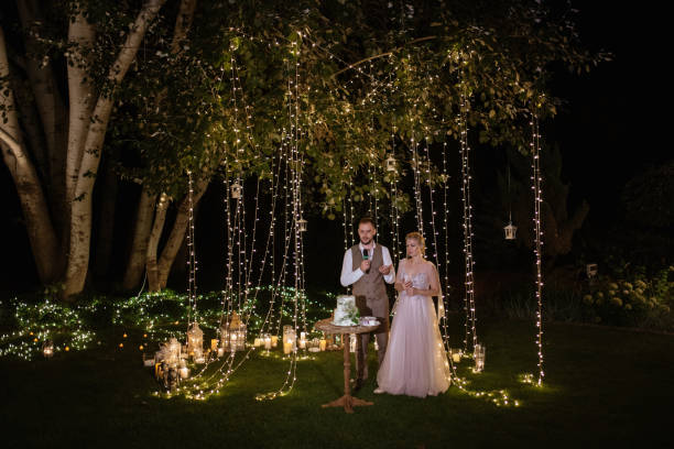 istock newlyweds happily cut and taste the wedding cake 1805649849