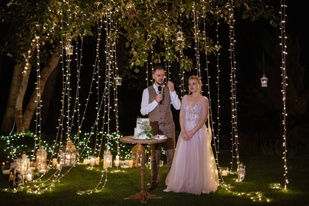 istock newlyweds happily cut and taste the wedding cake 1805651013