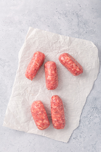Raw Italian sausage, delicious small Salsiccia sausages with herbs