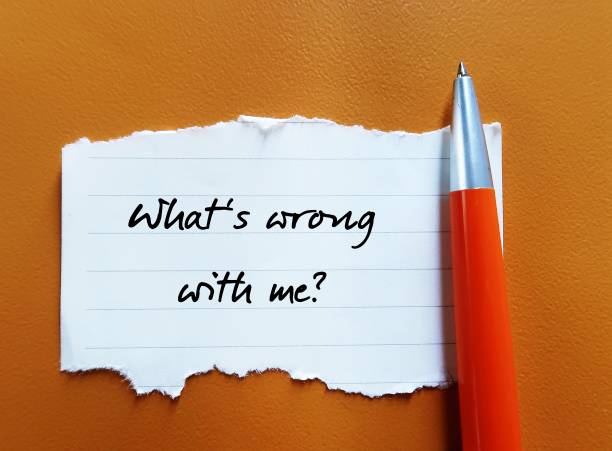 istock Torn paper with handwritten text - What's wrong with me?-  thought arises from personal insecurity, self-doubt, and judgment against onerself 1805654994