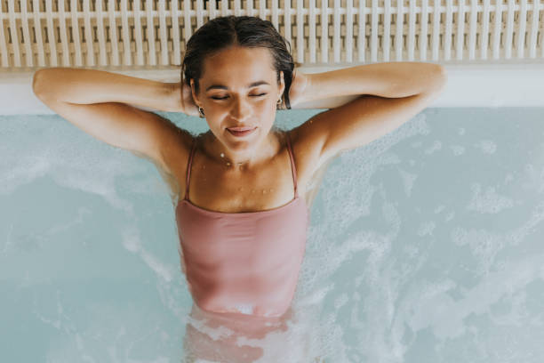 istock Young woman relaxing in the indoor bubble pool 1805662281