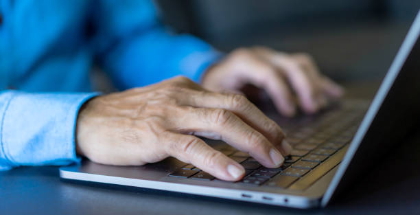 istock Man working online with laptop computer on desktop screen for advertising, mockup, technology, advertising, search information, blogger, creative design, learning, webinar, shopping, study, watching 1805664682