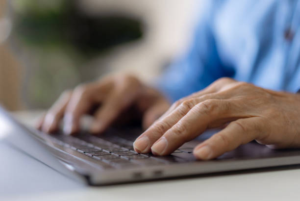 istock Man working online with laptop computer on desktop screen for advertising, mockup, technology, advertising, search information, blogger, creative design, learning, webinar, shopping, study, watching 1805664701