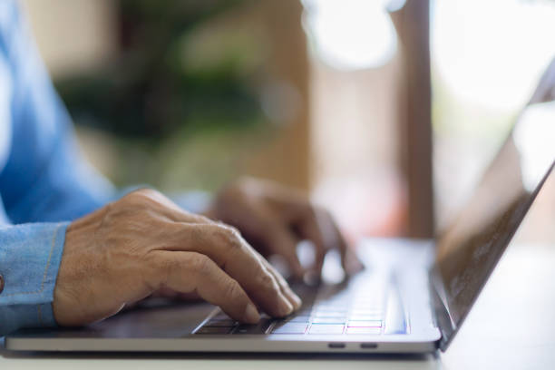 istock Man working online with laptop computer on desktop screen for advertising, mockup, technology, advertising, search information, blogger, creative design, learning, webinar, shopping, study, watching 1805664705