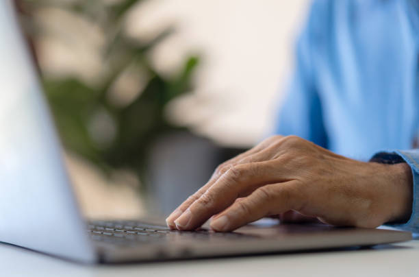 istock Man working online with laptop computer on desktop screen for advertising, mockup, technology, advertising, search information, blogger, creative design, learning, webinar, shopping, study, watching 1805664742