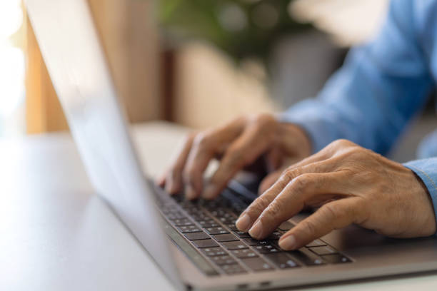 istock Man working online with laptop computer on desktop screen for advertising, mockup, technology, advertising, search information, blogger, creative design, learning, webinar, shopping, study, watching 1805665275