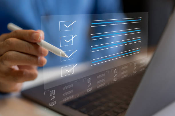 istock Human use laptop checking mark on checklist, survey, form, check mark, yes, questionnaire, filling digital, list, assessment, exam, vote, answer, to do list, evaluation, business and education concept 1805665314