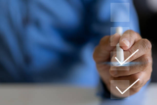 istock Human performance checking mark on checklist, survey, form, check mark, yes, questionnaire, filling digital, list, assessment, exam, vote, answer, to do list, evaluation, business and education concept 1805665316
