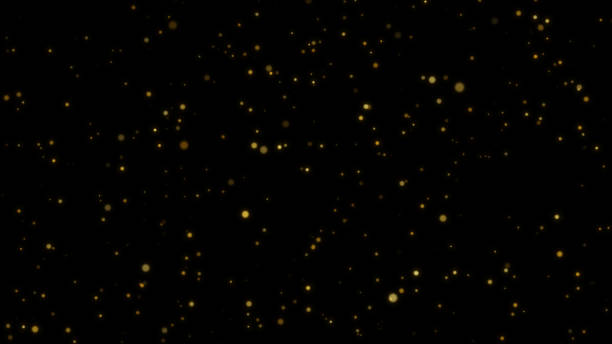 istock Particle gold dust flickering on black background 1805670233