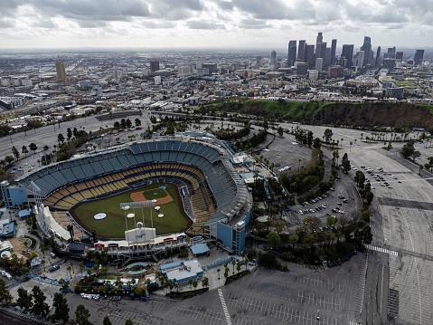 Los Angeles, United States – September 29, 2023: An aerial view of Dodger Stadium in Los Angeles, California, set against a backdrop of the city's downtown skyline