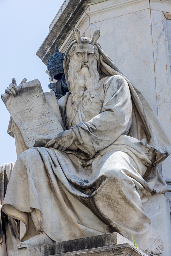 statues on the column of the Immaculate Conception in Piazza Mignanelli in Rome. The column was commissioned by Pope Pius IX and commemorates the dogma of the Immaculate Conception of Mary proclaimed by Pope Pius IX in 1854. The monument was designed by architect Luigi Poletti and was placed in front of the Palazzo di Propaganda Fide; Rome, Italy