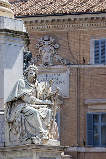 statues on the column of the Immaculate Conception in Piazza Mignanelli in Rome. The column was commissioned by Pope Pius IX and commemorates the dogma of the Immaculate Conception of Mary proclaimed by Pope Pius IX in 1854. The monument was designed by architect Luigi Poletti and was placed in front of the Palazzo di Propaganda Fide; Rome, Italy