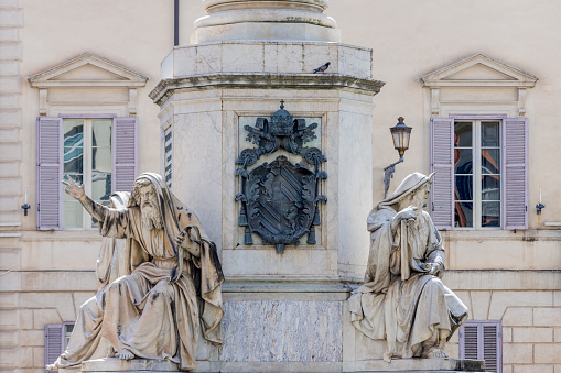 statues on the column of the Immaculate Conception in Piazza Mignanelli in Rome. The column was commissioned by Pope Pius IX and commemorates the dogma of the Immaculate Conception of Mary proclaimed by Pope Pius IX in 1854. The monument was designed by architect Luigi Poletti and was placed in front of the Palazzo di Propaganda Fide; Rome, Italy