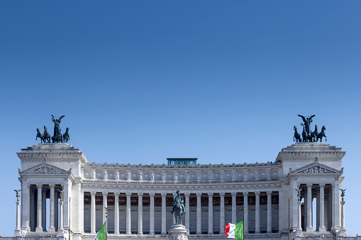 Austrian parliament building with Athena statue on the front in Vienna on the sunrise