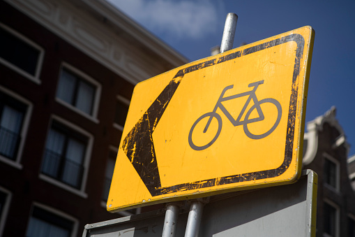 Yellow temporary sign for a bicycle lane in Amsterdam