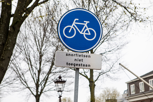 Houffalize,, Belgium - October 22, 2019: Multiple Belgian traffic direction signs in the town center of Houffalize.