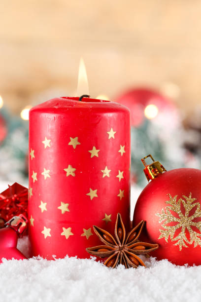 istock Christmas card advent time with burning candle decoration and copyspace copy space portrait format 1805695010