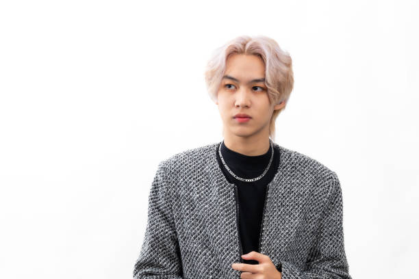 Grey informal business suit. Fashion portrait Asian young man. model, clothing and cosmetics. Young male model fashion lifestyle in fashionable clothing isolated on white background Grey informal business suit. Fashion portrait Asian young man. model, clothing and cosmetics. Young male model fashion lifestyle in fashionable clothing isolated on white background hair salon korea K pop style stock pictures, royalty-free photos & images