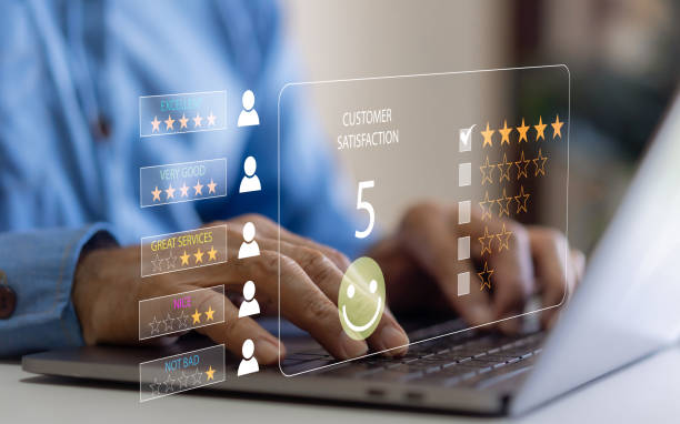 istock Customer service and satisfaction concept ,five star, customer, Business people using computer laptop happy smiley face icon, Quality assurance, give satisfaction in service. rating very impressed 1805710591